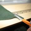 Use sharp scissors to trim underneath the side of the bias strip, close to the stitching, so that the strip has two finished edges and the raw edge is not visible.
